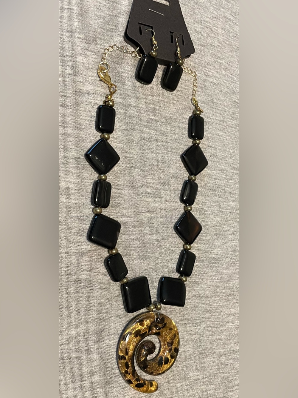 Elegant Black Beaded Necklace with Gold Swirl Glass Pendant- Matching Earrings